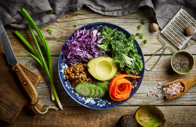 Power bowl, vegan bowl on wooden table, top view